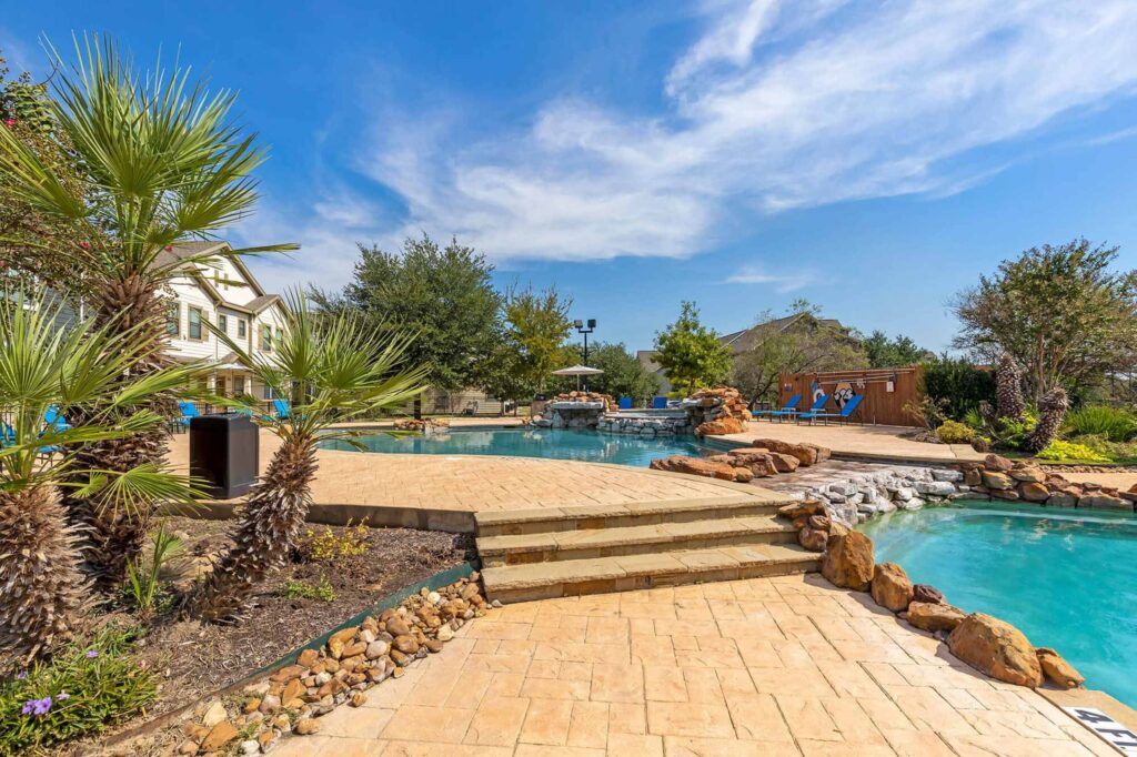 Two tier swimming pool with rock feature